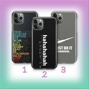 May include: Three phone cases with different designs. One case is black with a list of motivational words in various colors. Another case is black with the word "hahahahah" in white. The third case is gray with a white Nike swoosh and the text "JUST DO IT TOMORROW..."