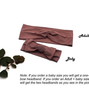 May include: Two mauve-colored headbands, one adult-sized and one baby-sized, are displayed on a white background. The adult headband features a twisted knot design, while the baby headband has a bow. Text on the image reads "Adult" and "Baby".