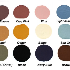May include: A color palette featuring twelve fabric swatches in various shades. Colors include Old Mauve, Clay Pink, Pink, Light Jeans, Camel, Ocher, Beige, Sea Green, Green (Olive), Black, Navy Blue, and Brown. Each swatch is labeled with its corresponding color name.