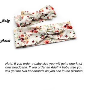 May include: Two floral headbands, one for a baby and one for an adult. The headbands feature a cream background with red, pink, and green floral patterns. The baby headband has a bow, while the adult headband is twisted.