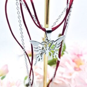 Red string necklace with butterfly pendant