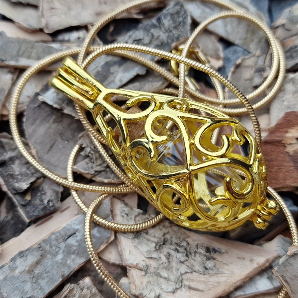 Pendentif cage VIAL DJINN avec petit flacon de parfum en verre