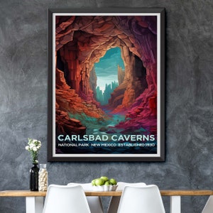 May include: A framed print of Carlsbad Caverns National Park in New Mexico. The artwork depicts a colorful cave interior with a river and text that reads "Carlsbad Caverns National Park New Mexico Established 1930."