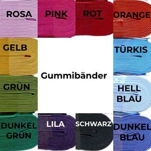 May include: A collection of colorful elastic bands in various colors, including pink, red, orange, yellow, green, blue, purple, black, and white. The elastic bands are labeled with their colors in German.