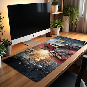 May include: A rectangular mousepad featuring a vibrant illustration of Deadpool in his signature red and black suit, set against a cityscape backdrop. The design includes a building and a sunset.