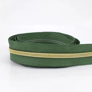 Zipper in dark green/gold - 1 m - endless