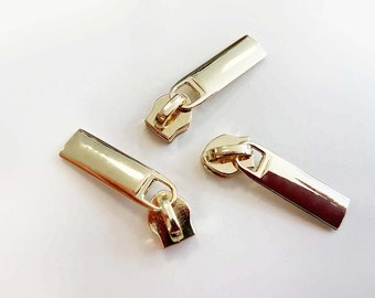 Zipper für Reißverschlüsse in 6 mm - gold