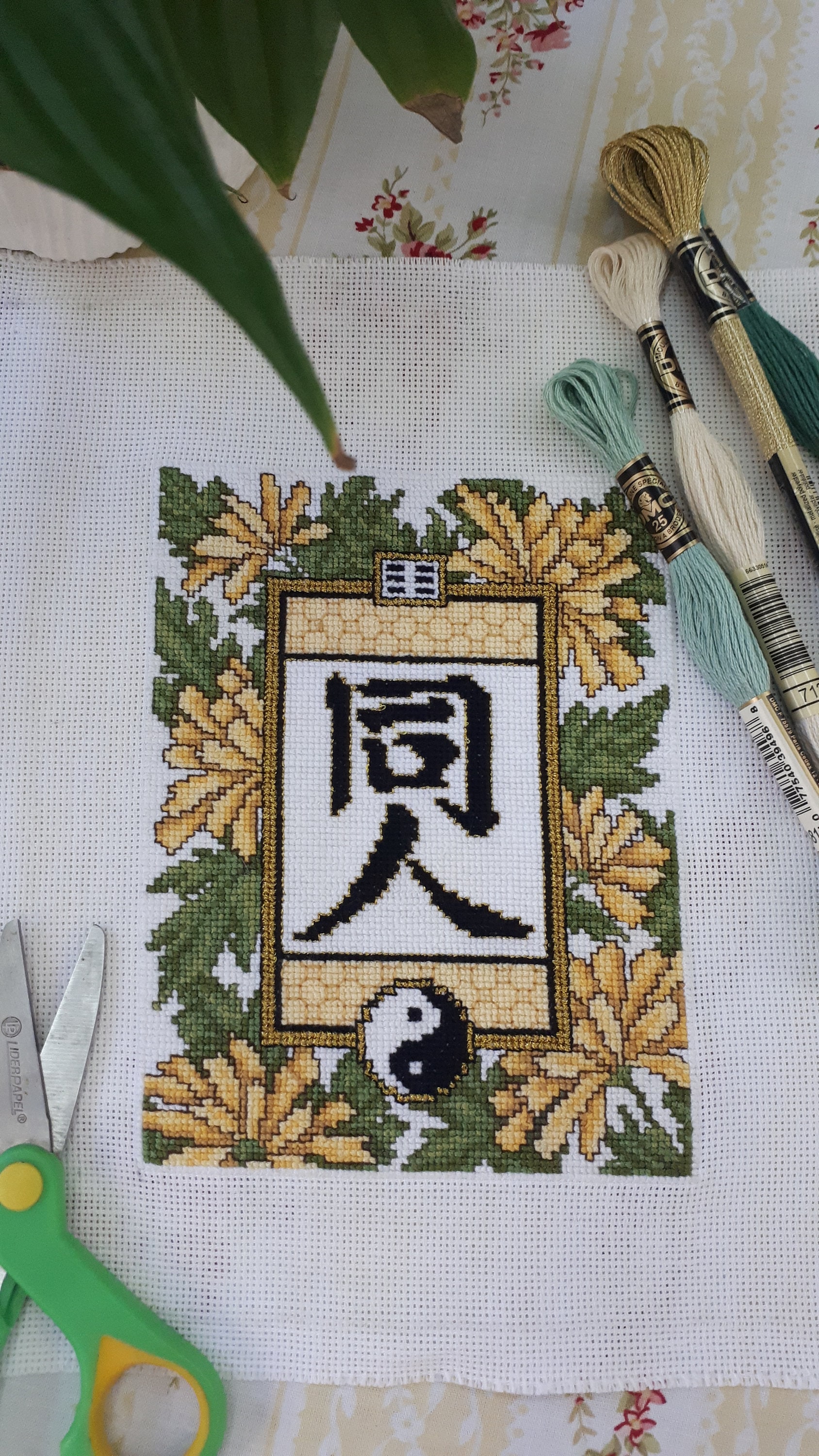 Cross stitch chinese inspired motifs including the characters for the