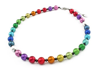 May include: A rainbow colored beaded necklace with black beads separating each color. The necklace is made of round beads and has a silver clasp.