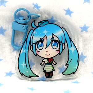 May include: A blue and white anime character keychain with a blue and white striped dress and a blue bow. The keychain is made of clear acrylic and has a metal clasp.