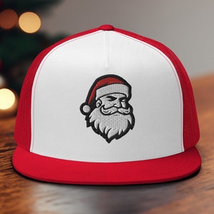 May include: A white and red baseball cap with a Santa Claus graphic embroidered on the front. The cap has a mesh back.