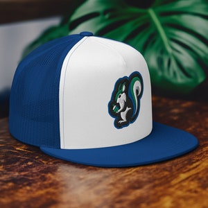 May include: A white and blue trucker hat with a green and black squirrel logo. The squirrel is holding a nut in its paws.