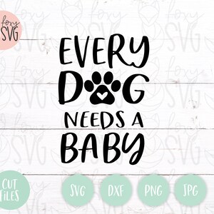 May include: Black and white graphic design with the text "Every Dog Needs a Baby" with a paw print with a heart in the center.