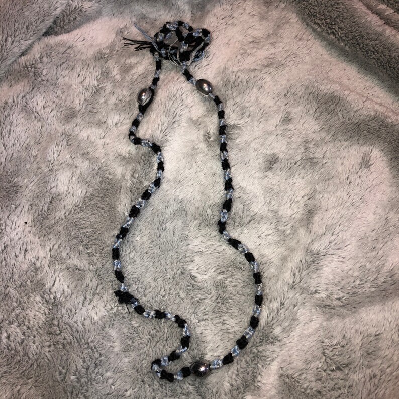 Braided necklace with silver beads