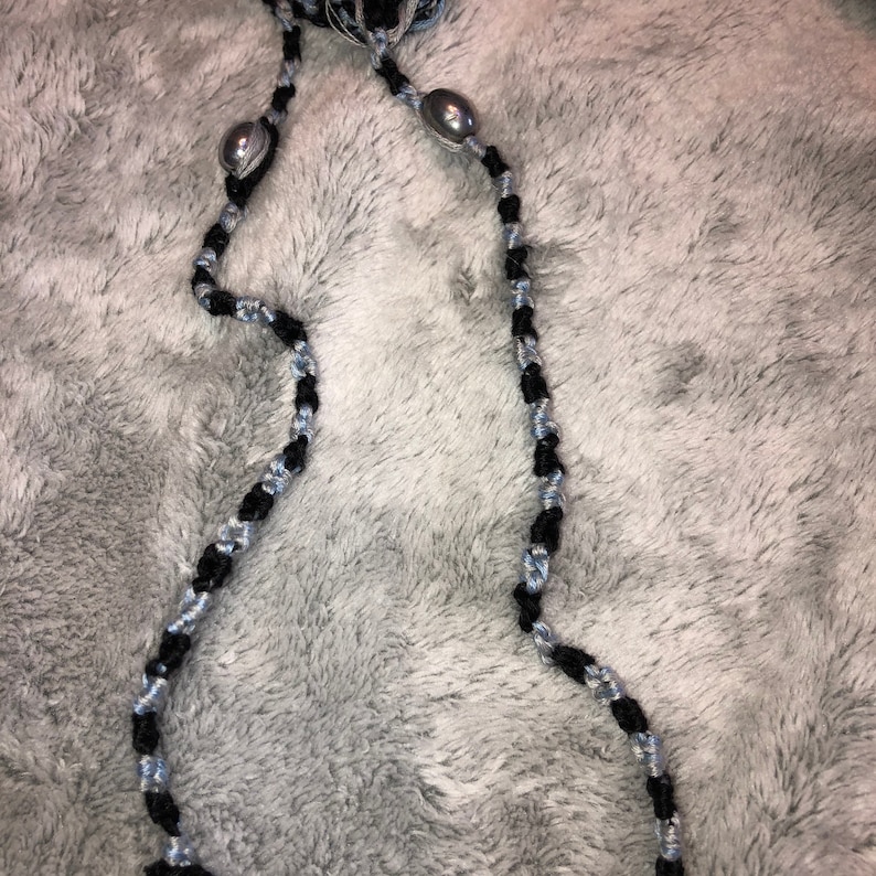 Braided necklace with silver beads