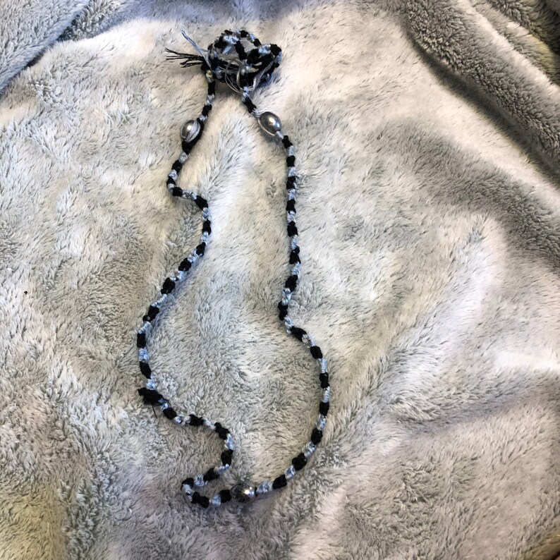 Braided necklace with silver beads