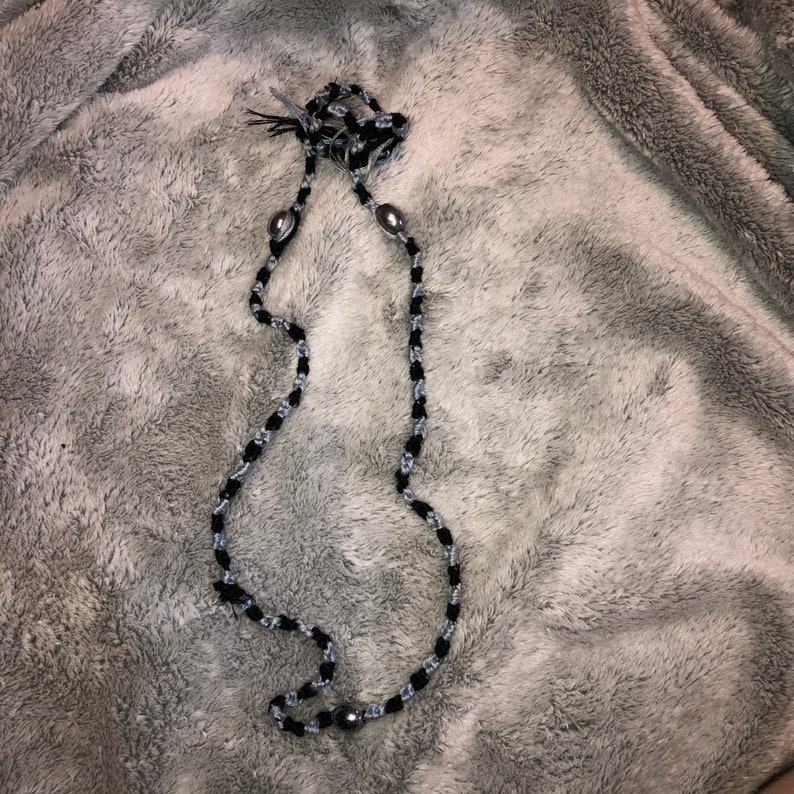 Braided necklace with silver beads