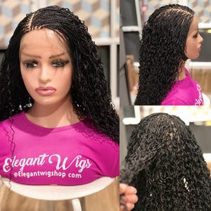 May include: A black micro-braided lace front wig styled with long, curly strands. The wig is displayed on a mannequin head wearing a pink shirt with the text "Elegant Wigs" and the website address. The wig's texture and style are visible from multiple angles.