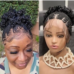 May include: A black lace front wig featuring intricate cornrow braids arranged in a geometric pattern across the scalp, transitioning into a voluminous, curly high bun. The wig includes sheer lace at the hairline with styled baby hairs.