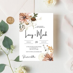 May include: Wedding invitation with a floral design in shades of brown, white, and pink. The text reads "Your invited to the wedding of Lacy + Mark, Friday, 28 August, at six o'clock in the evening, 123 Anywhere St, Any City, ST 12345, RSVP at www.lacy&mark.com, Reception to follow."