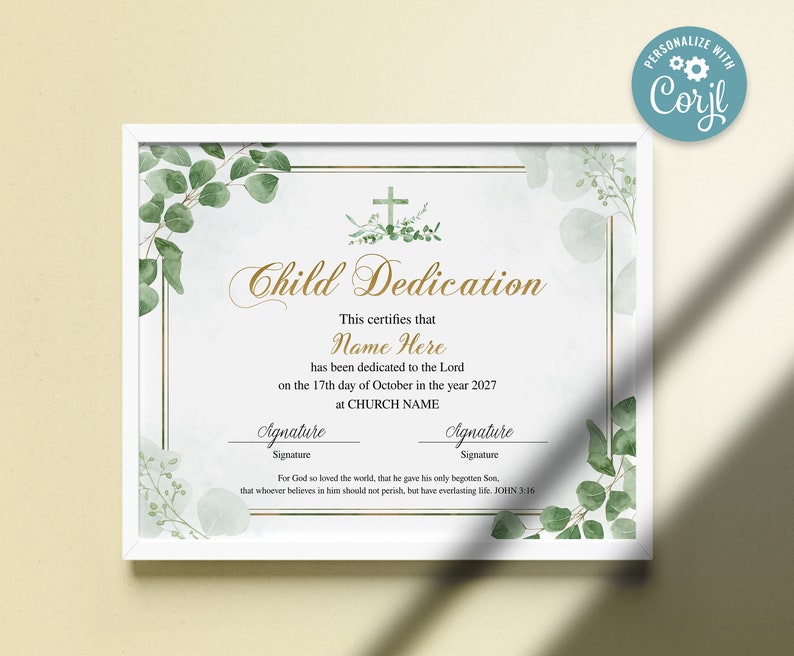 May include: A framed Child Dedication certificate with a white border. The certificate features gold text and a cross design with green foliage. The text includes "Name Here" and "CHURCH NAME".
