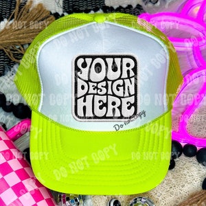 May include: A neon green and white trucker hat with a black and white patch that says "YOUR DESIGN HERE".