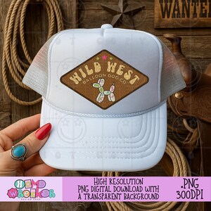 May include: White trucker hat with a mesh back and a brown diamond-shaped patch featuring the text "Wild West Balloon Dog Co." and a balloon dog illustration. The hat has a curved brim and a white front panel.