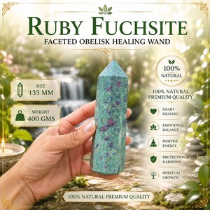 May include: A faceted Ruby Fuchsite obelisk healing wand with a green and magenta speckled appearance. The text on the image reads Ruby Fuchsite, Faceted Obelisk Healing Wand, 135 mm, 400 gms, 100% Natural Premium Quality, Heart Healing, Emotional Balance, Positive Energy, Protection and Harmony, and Spiritual Growth.