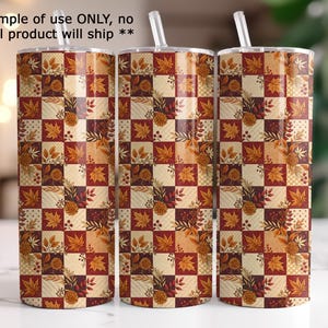 three cylindrical objects with a repeating pattern of autumn leaves and flowers on their surfaces.