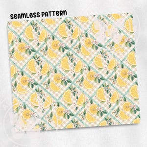 a seamless pattern of yellow lemon slices arranged in a checkered design, with green leaves and flowers interspersed throughout the pattern.