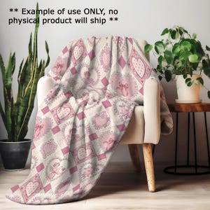 a cozy indoor setting with a chair, a potted plant, and a blanket with a heart pattern. The blanket is draped over the chair, creating a warm and inviting atmosphere.