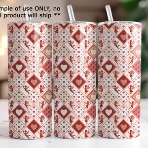 three cylindrical objects with a repeating pattern of red and white hearts and dancing cherubs on their surfaces.