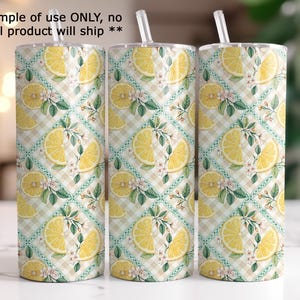 three cylindrical objects with a repeating pattern of yellow lemon slices and green leaves on a white background.