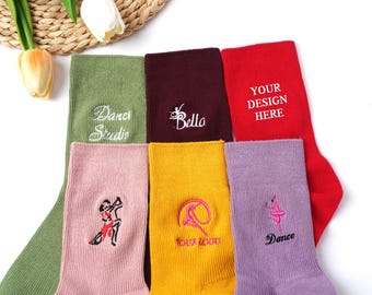 May include: Assorted colorful socks with embroidered designs and text. Colors include green, burgundy, red, pink, yellow, and purple. Text includes "Dance Studio", "Bello", "YOUR DESIGN HERE", "Your Logo", and "Dance".