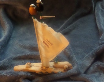 Driftwood boat with sails