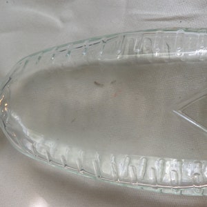 Small glass bottle with measurements 4 and a half inches tall