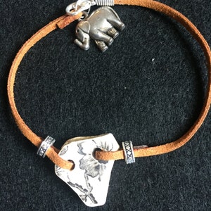 Ceramic piece and charm bracelet