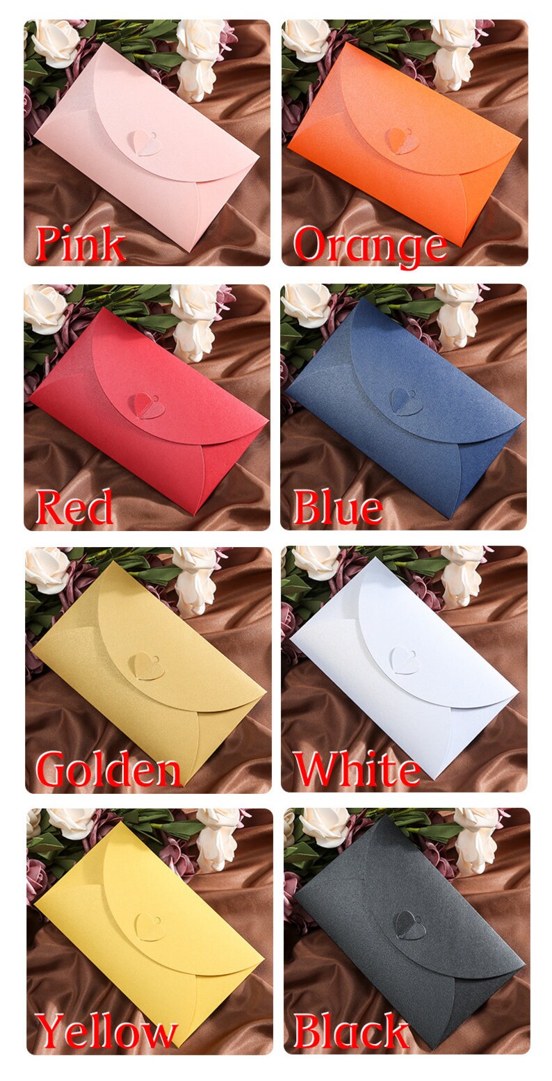 May include: A collection of eight colorful envelopes in pink, orange, red, blue, golden, white, yellow, and black. Each envelope has a heart-shaped closure. The word for each color is displayed below each envelope.