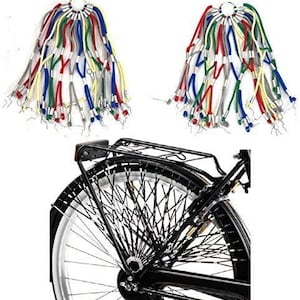 May include: A set of colourful spoke reflectors for bicycle wheels. The reflectors are made of plastic and come in a variety of colours, including red, blue, green, yellow, and white. The reflectors are attached to the spokes of the bicycle wheel with a small metal clip. The reflectors are designed to increase visibility and safety when riding at night.