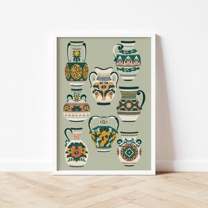 May include: A framed art print showcasing a selection of decorative vases. The vases display diverse shapes and sizes, embellished with detailed floral and geometric designs in teal, yellow, pink, and orange, set against a muted green backdrop.