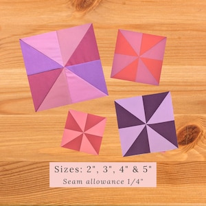 May include: Four fabric squares in various shades of pink, purple, and red, each with a pinwheel design. The squares are 2 inches, 3 inches, 4 inches, and 5 inches in size. The text "Sizes: 2", 3", 4" & 5" Seam allowance 1/4" is written below the squares.