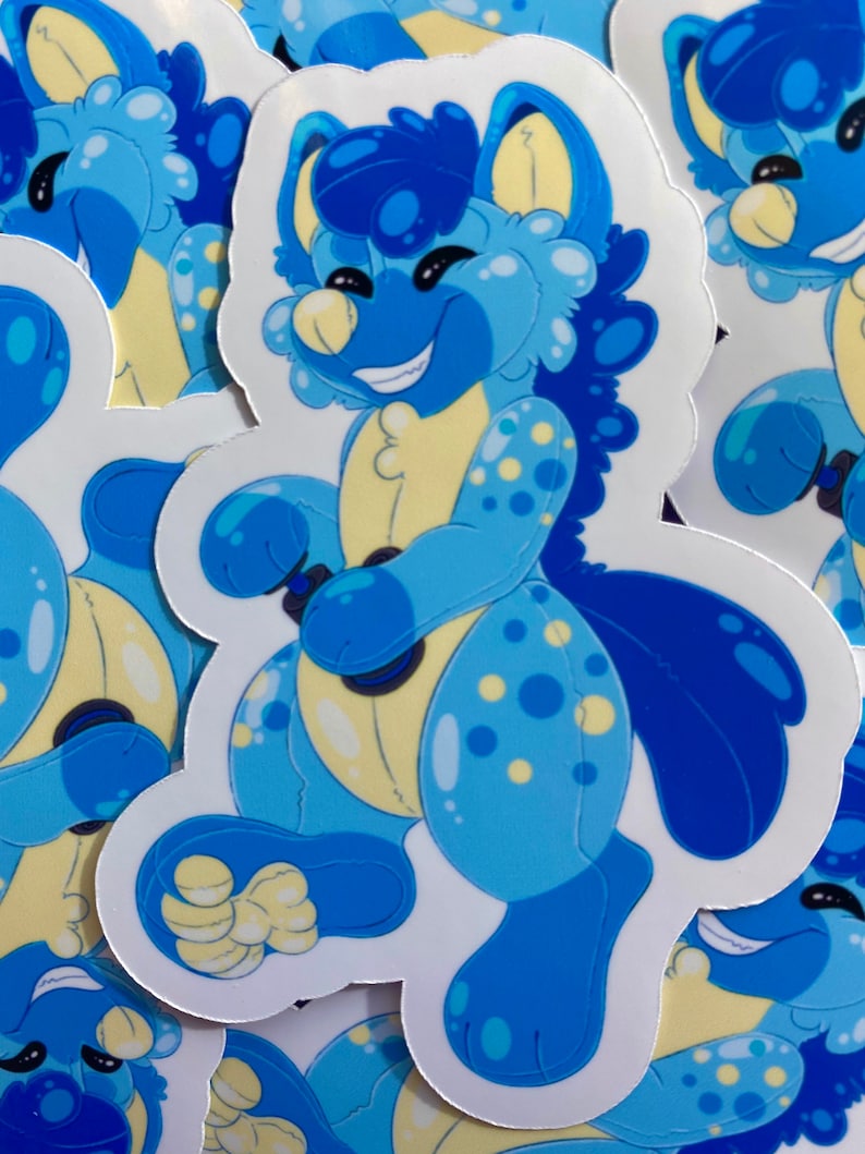 May include: A blue and yellow cartoon character sticker with a smiling face and a spotted body. The character is holding a blue and black object in its hands.