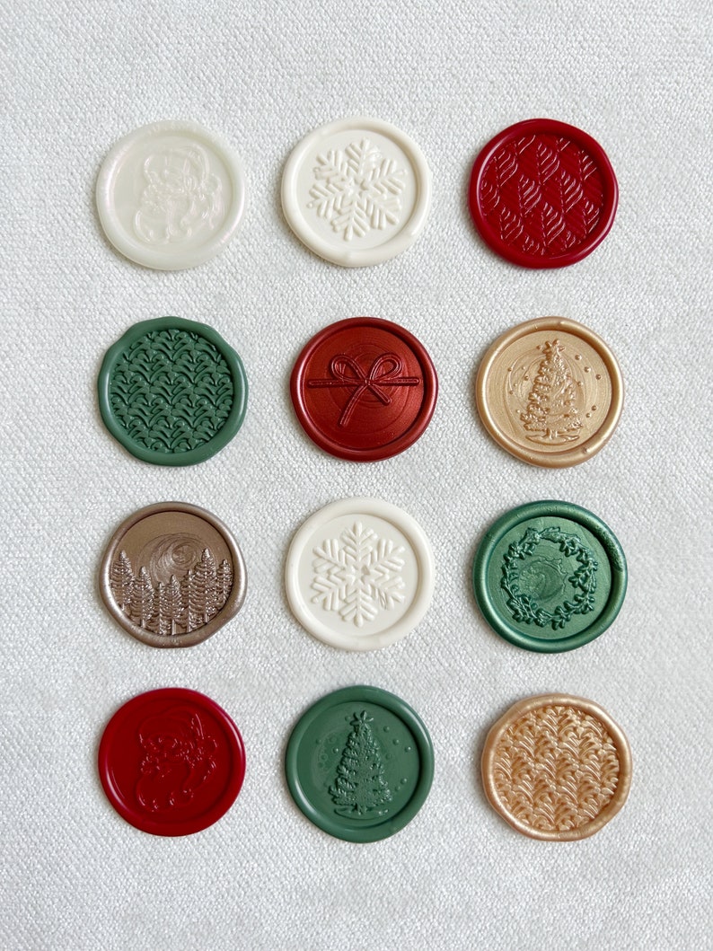 May include: Twelve round wax seals with various Christmas-themed designs. The seals are in red, green, gold, and white.