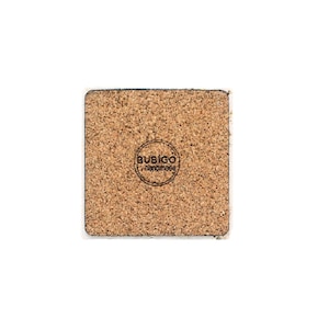 May include: Square cork coaster with a white border. The coaster has a natural brown color and a textured surface. The bottom of the coaster features a circular logo with the text "BUSIGO handmade".