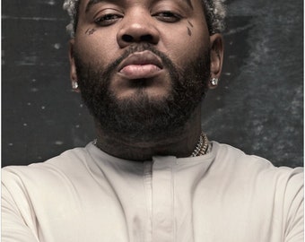 Kevin Gates shares video where he gets his hair flat ironed