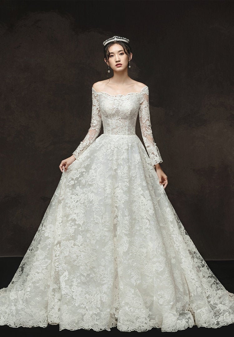 Chic Long A-line Off-the-shoulder Lace Beading Wedding Dress with Long Sleeves main image 0