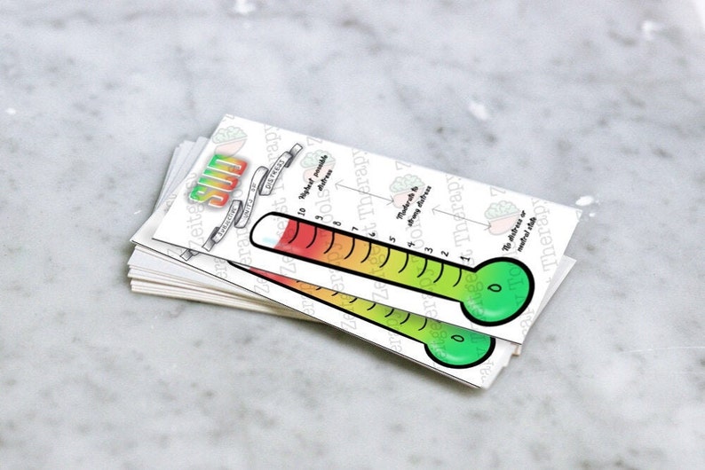 May include: A stack of white cards with a green, yellow, and red thermometer printed on them. The thermometer is labeled "Sun" and has numbers from 0 to 10. The card also has text that reads "Frequency of Distress" and "Highest possible distress".
