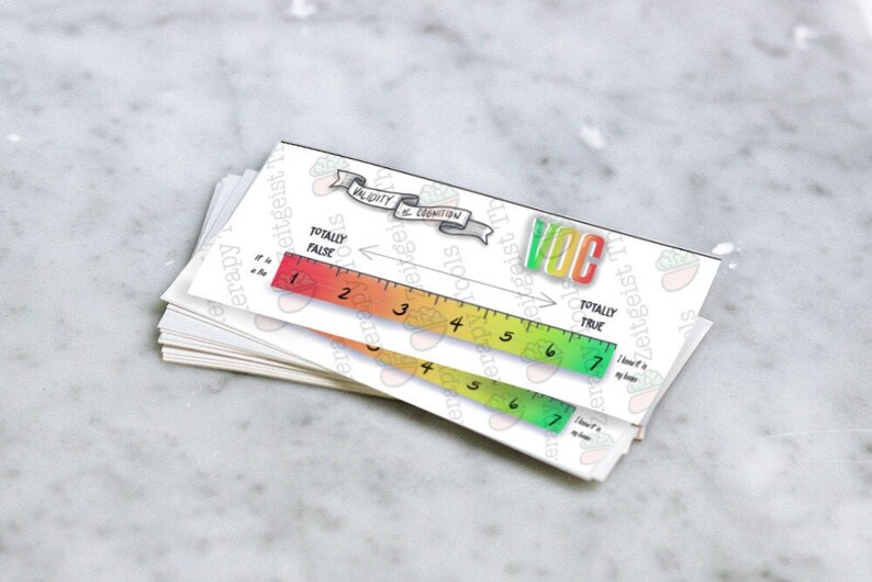May include: A white card with a ruler and a scale labeled "Validity is Cognition". The ruler is marked with numbers 1 through 7 and the scale is labeled "Totally False" on the left and "Totally True" on the right. The card is a tool for measuring the validity of a statement.