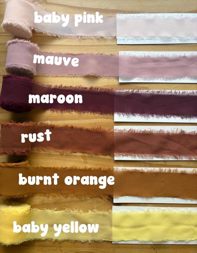 May include: A selection of fabric ribbons in various colors, including baby pink, mauve, maroon, rust, burnt orange, and baby yellow. Each ribbon has a frayed edge and is labeled with its color name in white text.