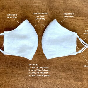 May include: Two white face masks with adjustable nose wires and filter pockets. The mask on the left has soft elastic ear loops. The mask on the right has soft elastic ear loops with adjusters. Options for 2-layer and 3-layer masks with or without adjusters are listed below.